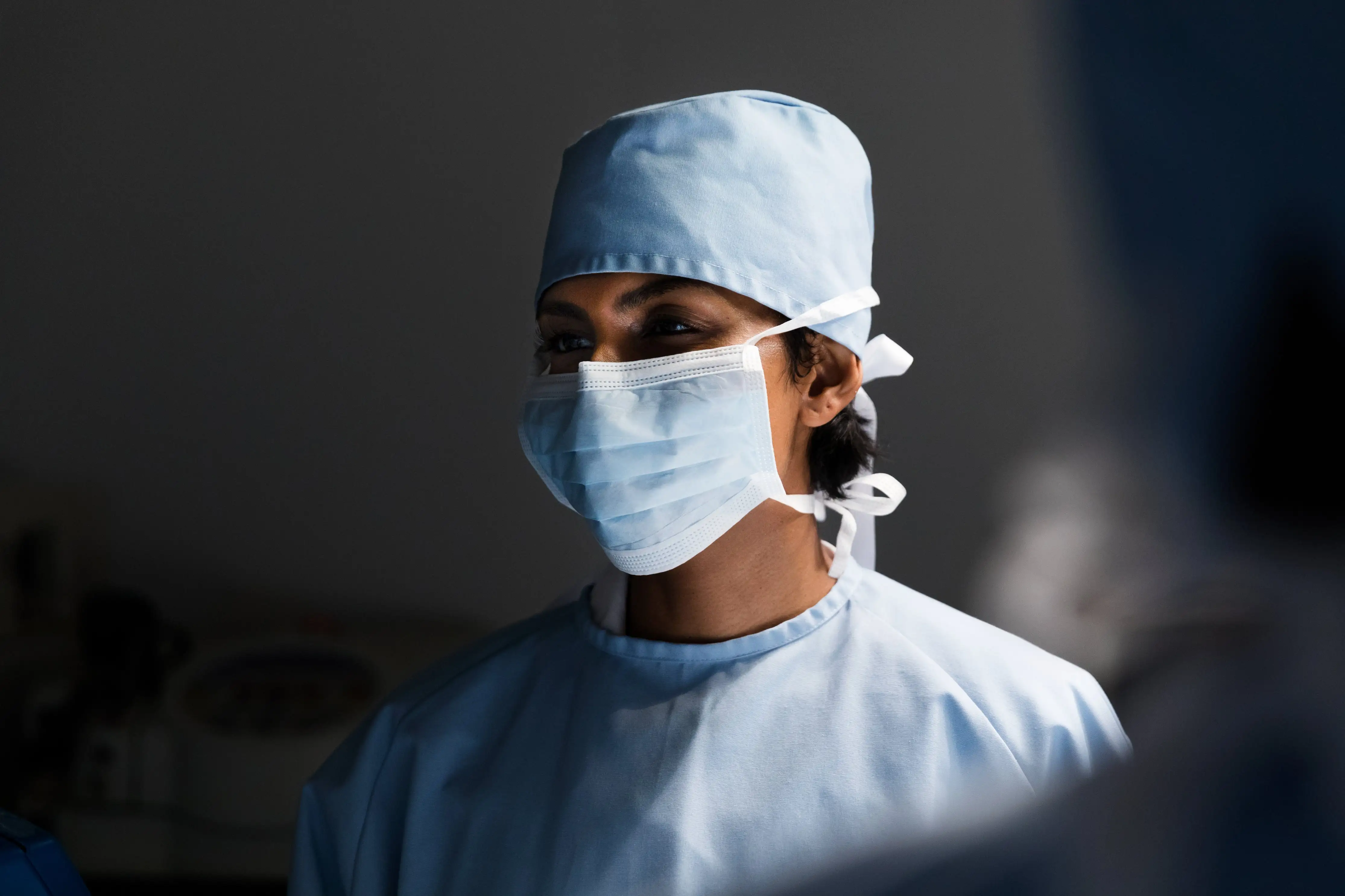 A woman healthcare professional being trained in the aspects described